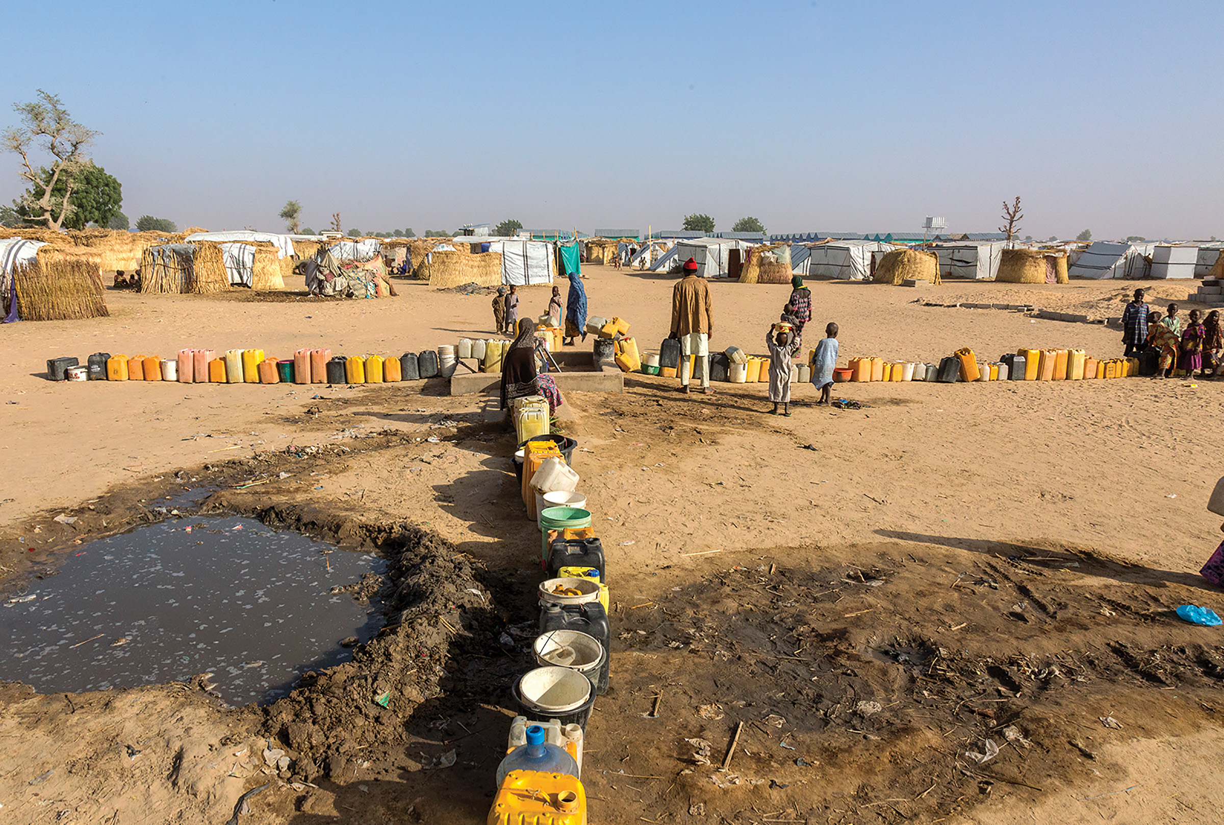 An estimated 15,000 people live in the Muna Garage camp, an informal settlement on private land. 